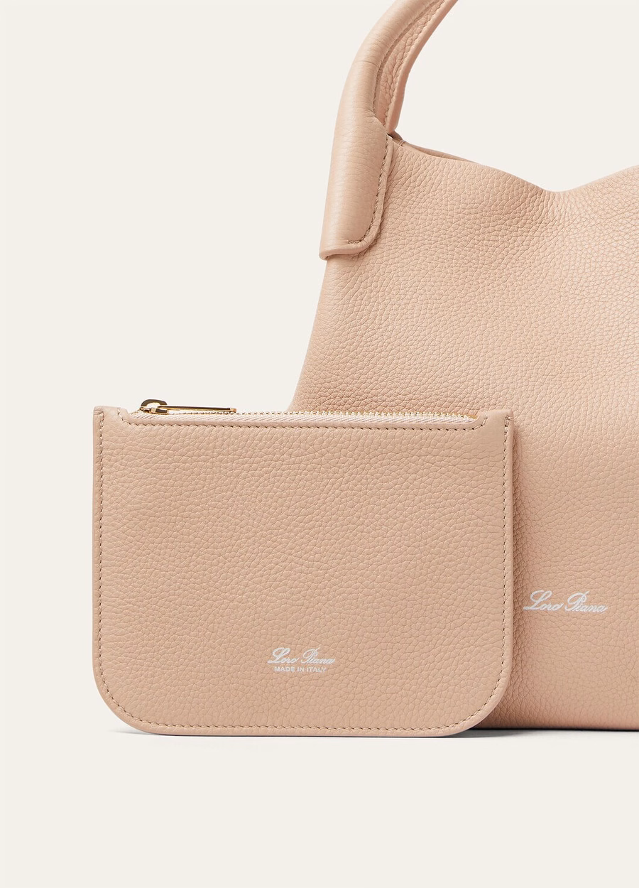 Bolsa pequena de vime em couro de bezerro granulado rosa-claro/dourado-sol